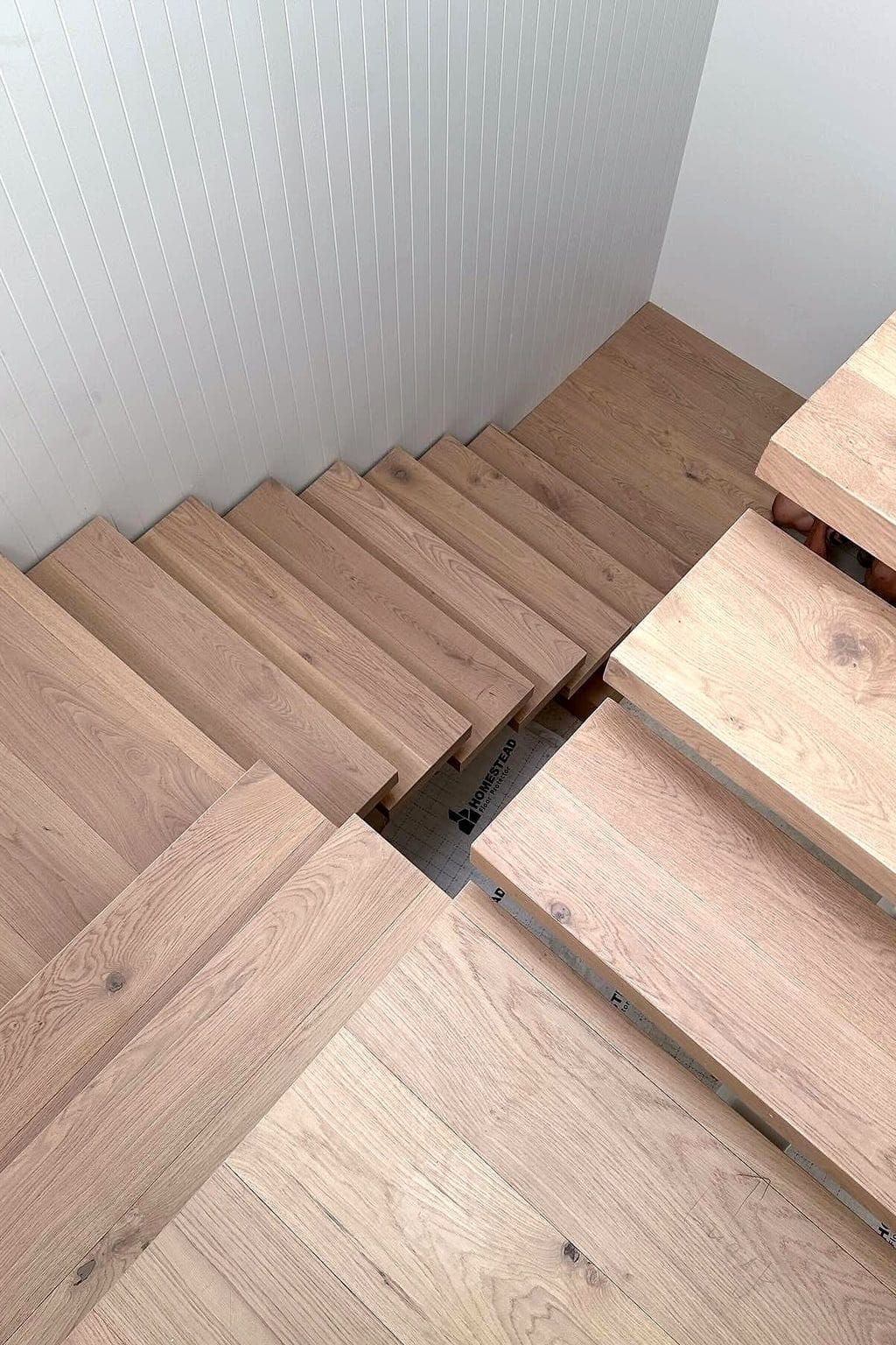 Solid timber stair treads with open risers, the grain running across each tread